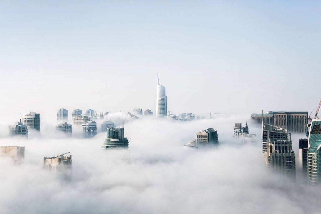 City with surrounding Clouds