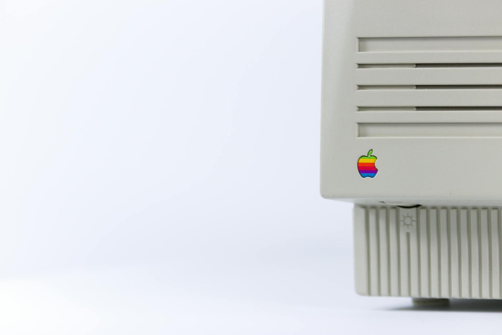 gray device with apple logo on white surface